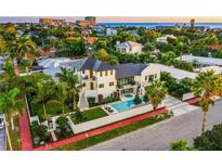 Stunning two-story home with modern design, private pool, and lush landscaping near the beach at 340 Jackson Dr, Sarasota, FL 34236