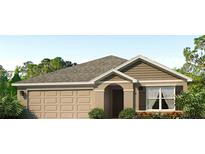 Charming single-story home featuring a two-car garage, neutral color palette, and inviting front entrance at 4407 Dusky Dawn Ln, Palmetto, FL 34221