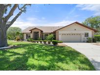 Charming single-story home with a well-manicured lawn and attached two-car garage at 4622 34Th E Ct, Bradenton, FL 34203