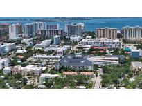 Stunning aerial view of a coastal community, showcasing city skyline and waterfront at 631 N Orange Ave # 208, Sarasota, FL 34236
