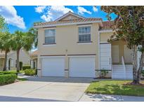 Charming two-story condo featuring a tile roof, a two car garage and a well maintained lawn in a great neighborhood at 6335 Bay Cedar Ln, Bradenton, FL 34203
