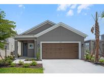 Charming single-Gathering home with a two-car garage, landscaped yard and covered entryway at 8632 Snowfall St, Sarasota, FL 34241
