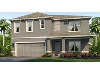 Charming two-story home featuring a gray exterior, attached two-car garage, and a well-manicured front yard at 18123 Wheathouse Pl, Lakewood Ranch, FL 34211