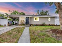 Charming single-story home featuring a covered carport and a well-maintained front yard at 2105 19Th W St, Bradenton, FL 34205