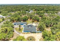 Expansive property featuring a pool, a detached garage, and a circular driveway with a fountain at 2726 Desoto Rd, Sarasota, FL 34234
