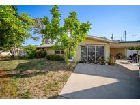 Charming single-story home featuring a cozy covered entry and a well-maintained front yard at 3468 Roslyn Rd, Venice, FL 34293