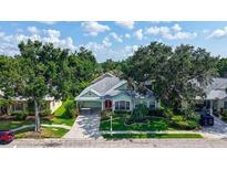 Charming single-story home with lush landscaping, well-manicured lawn, mature trees, and inviting curb appeal at 4612 4Th E Ave, Bradenton, FL 34208
