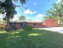Charming one-story home with a well-maintained lawn and separate garage building at 6923 13Th E Ave, Bradenton, FL 34208