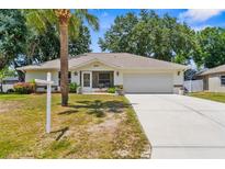 Charming single-story home with a well-maintained lawn and a two-car garage, perfect for Gathering living at 8638 Bessemer Ave, North Port, FL 34287