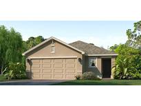 Inviting one-story home featuring a neutral color palette, attached two-car garage, and well-manicured lawn at 10706 Hidden Banks Gln, Parrish, FL 34219