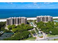 Luxury beachfront condominiums featuring stunning ocean views, lush landscaping, and resort-style amenities at 435 L Ambiance Dr # Ph-J, Longboat Key, FL 34228