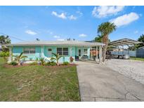 Charming single-story home featuring a well-manicured lawn and a convenient covered carport at 4519 Brooksdale Dr, Sarasota, FL 34232