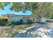 Charming home with a beautiful green yard and a mature tree providing ample shade at 4907 18Th W Ave, Bradenton, FL 34209