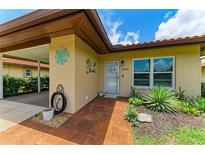Charming front entrance with decorative details and terra cotta tile at 3213 Mercer Rd, Bradenton, FL 34207