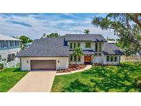 An aerial view of a beautiful two-story home with a well-manicured lawn and a two-car garage at 4506 17Th W St, Palmetto, FL 34221