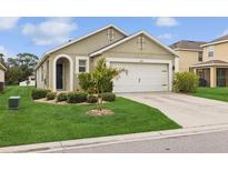 Charming single-story home with well-manicured lawn and an attached two-car garage at 4833 San Palermo Dr, Bradenton, FL 34208