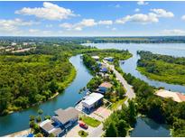 Beautiful waterfront home with stunning aerial views of the surrounding waterways and lush landscapes at 6406 Lincoln Rd, Bradenton, FL 34203