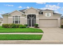 Charming single-story home with well-maintained landscaping and attached two car garage at 7744 Castleisland Dr, Sarasota, FL 34240