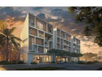 Modern condo building exterior with balconies, wood accents, street view, and tropical landscaping at sunset at 430 Kumquat Ct # 410, Sarasota, FL 34236