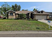 Charming one-story home with a well-manicured lawn and mature landscaping at 3110 57Th Avenue E Cir, Bradenton, FL 34203