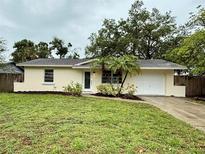 Charming single-story home with a well-maintained lawn and fresh landscaping at 4110 Longhorn Dr, Sarasota, FL 34233