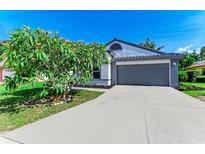 Charming single-story home with a well-manicured lawn and a two-car garage at 5508 83Rd E Ter, Sarasota, FL 34243