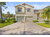 Charming two-story home with a well-maintained lawn and a two-car garage at 6310 Green Oak Cir, Bradenton, FL 34203