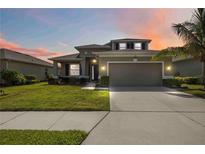 Charming two-story home features a well-manicured lawn and a spacious two-car garage at 6377 Mighty Eagle Way, Sarasota, FL 34241