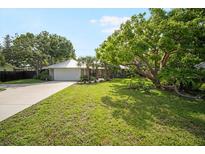 Charming single story home with a metal roof and mature, well-maintained landscaping at 1207 71St Nw St, Bradenton, FL 34209
