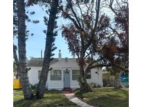 Charming single-story home with a well-manicured front yard and inviting blue front door at 3038 Dupont S St, Gulfport, FL 33707