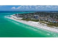 Stunning aerial view of beachfront condo community with pristine white sand beach and turquoise water at 222 Beach Rd # 7, Sarasota, FL 34242