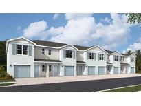Charming townhomes feature light blue doors, shutters and one-car garages on a sunny day at 4617 Pleasant Ave, Palm Harbor, FL 34683