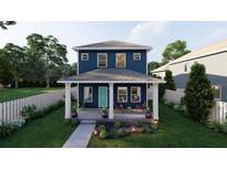 Charming two-story home with a covered front porch and beautiful landscaping at 4755 11Th S Ave, St Petersburg, FL 33711