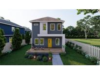 Modern two-story home features a minimalist design, yellow door, and welcoming front porch with seating at 4759 11Th S Ave, St Petersburg, FL 33711