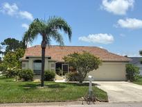 Charming single-story home with well-maintained lawn and mature landscaping at 4811 14Th E Ave, Bradenton, FL 34208