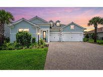 Charming single-Gathering home with a two-car garage and manicured lawn at 12139 Cranston Way, Bradenton, FL 34211