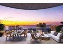 Expansive balcony featuring dining and seating with stunning sunset and water views at 290 Cocoanut Ave # 6A, Sarasota, FL 34236