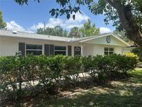 Charming single-story home with well-maintained landscaping, offering a serene and inviting curb appeal at 4149 Prudence Dr, Sarasota, FL 34235
