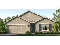 Charming single-story home with a two-car garage, neutral color scheme, and well-manicured lawn at 4324 112Th E St, Palmetto, FL 34221