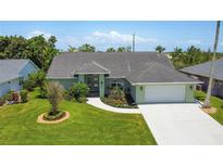 Charming single-story home with a well-manicured lawn and attached two car garage at 5207 86Th Street W Ct, Bradenton, FL 34210
