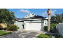 Charming home with a well-manicured lawn, complemented by a lush garden and a spacious two-car garage at 6107 French Creek Ct, Ellenton, FL 34222