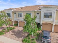 Beautifully maintained townhomes with brick driveways, tan exteriors, and two car garages at 7325 Skybird Rd # 399, Bradenton, FL 34209
