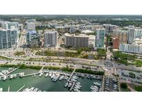 Stunning aerial view of the city, featuring the marina, waterfront, and cityscape at 1255 N Gulfstream Ave # 1104, Sarasota, FL 34236