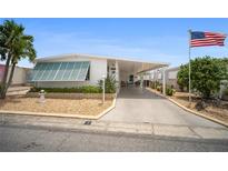 Charming single-story home with a carport, lovely landscaping, and a welcoming facade at 2107 Palma Sola Blvd # 7, Bradenton, FL 34209