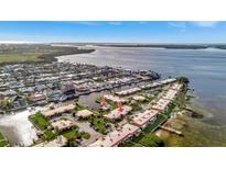 Wide aerial shot of a waterfront community with beautiful water views and private boat slips at 3876 Catalina Dr, Bradenton, FL 34210
