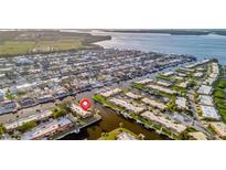 Waterfront community featuring charming homes with private boat docks along winding canals and easy access to the open bay at 4096 El Dorado Cv, Bradenton, FL 34210