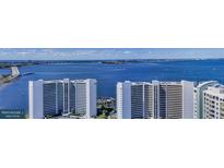 Beautiful aerial view of the modern high-rise condominiums with expansive views of the ocean and city at 555 Quay Cmn # 2004, Sarasota, FL 34236