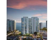 Modern high-rise condos with beautiful waterfront views and manicured landscaping at 555 Quay Commons # 1402, Sarasota, FL 34236