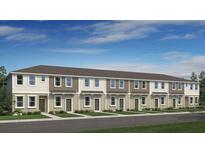 New townhome exterior featuring neutral siding, manicured lawns and professional landscaping at 8620 Daybreak St, Sarasota, FL 34241