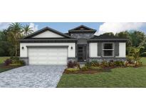 Charming single-Gathering home featuring a two-car garage, stone accents, and professionally landscaped front yard at 1749 Cobb Trl, Parrish, FL 34219